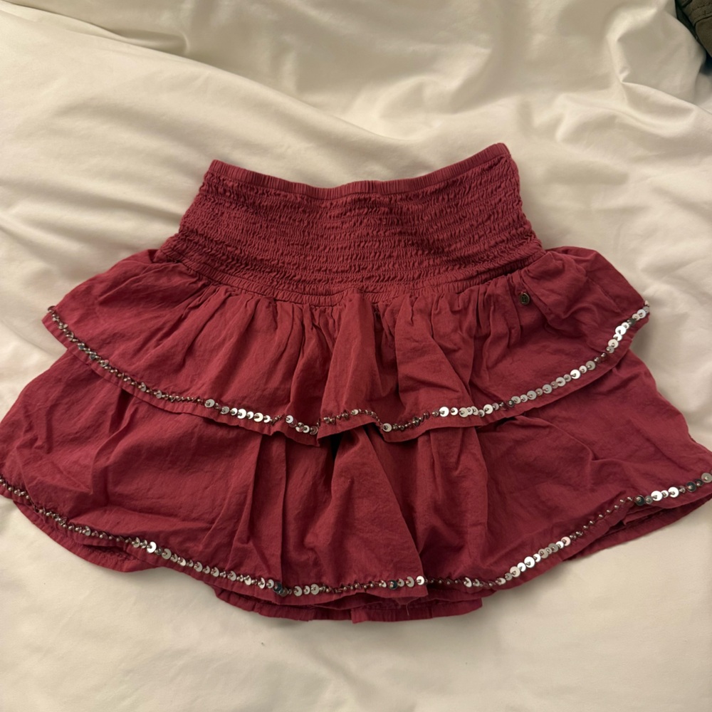 “Brownie” raspberry frilled mini skirt with built in shorts and sequin trimming